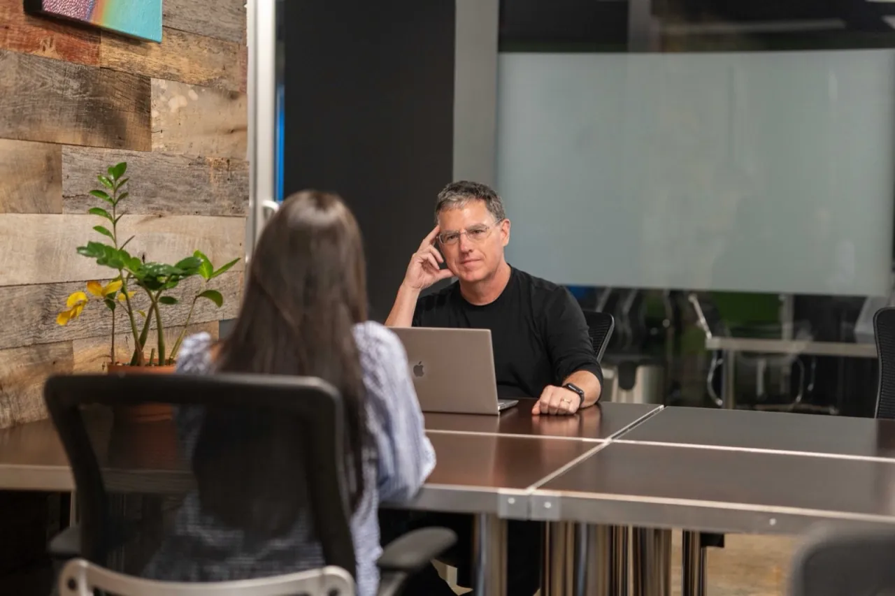 Will Montague in conversation with a client